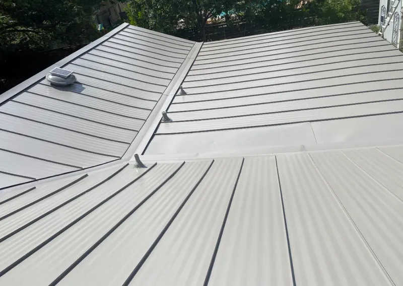 Solar attic fan installed on a metal roof for Roof Ventilation in Mount Vernon